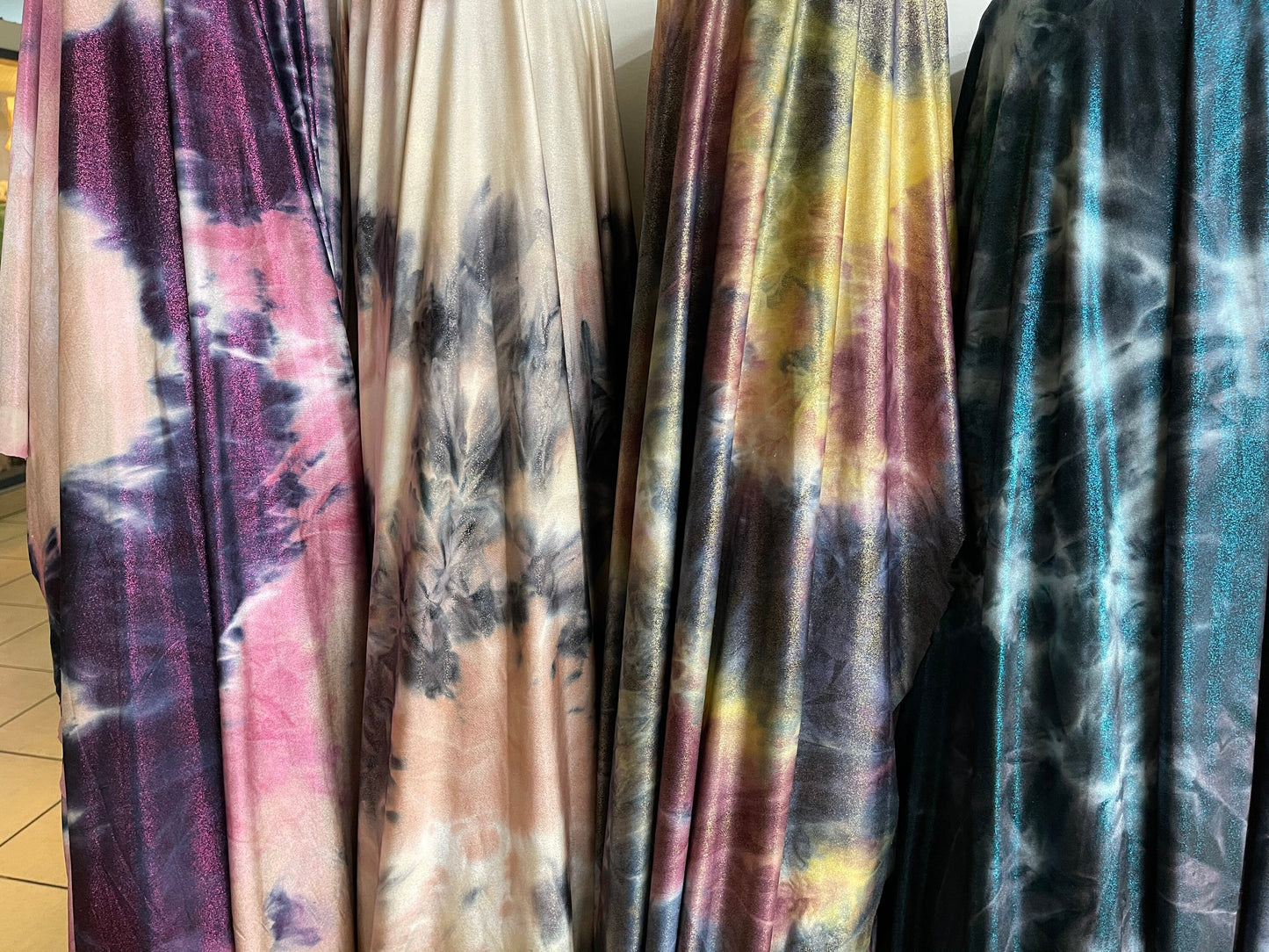 Tie dye design with foggy foil print on poly brushed spandex 2-way stretch 58/60” light weight 58/60” Sold by the YD. Ships  Worldwide