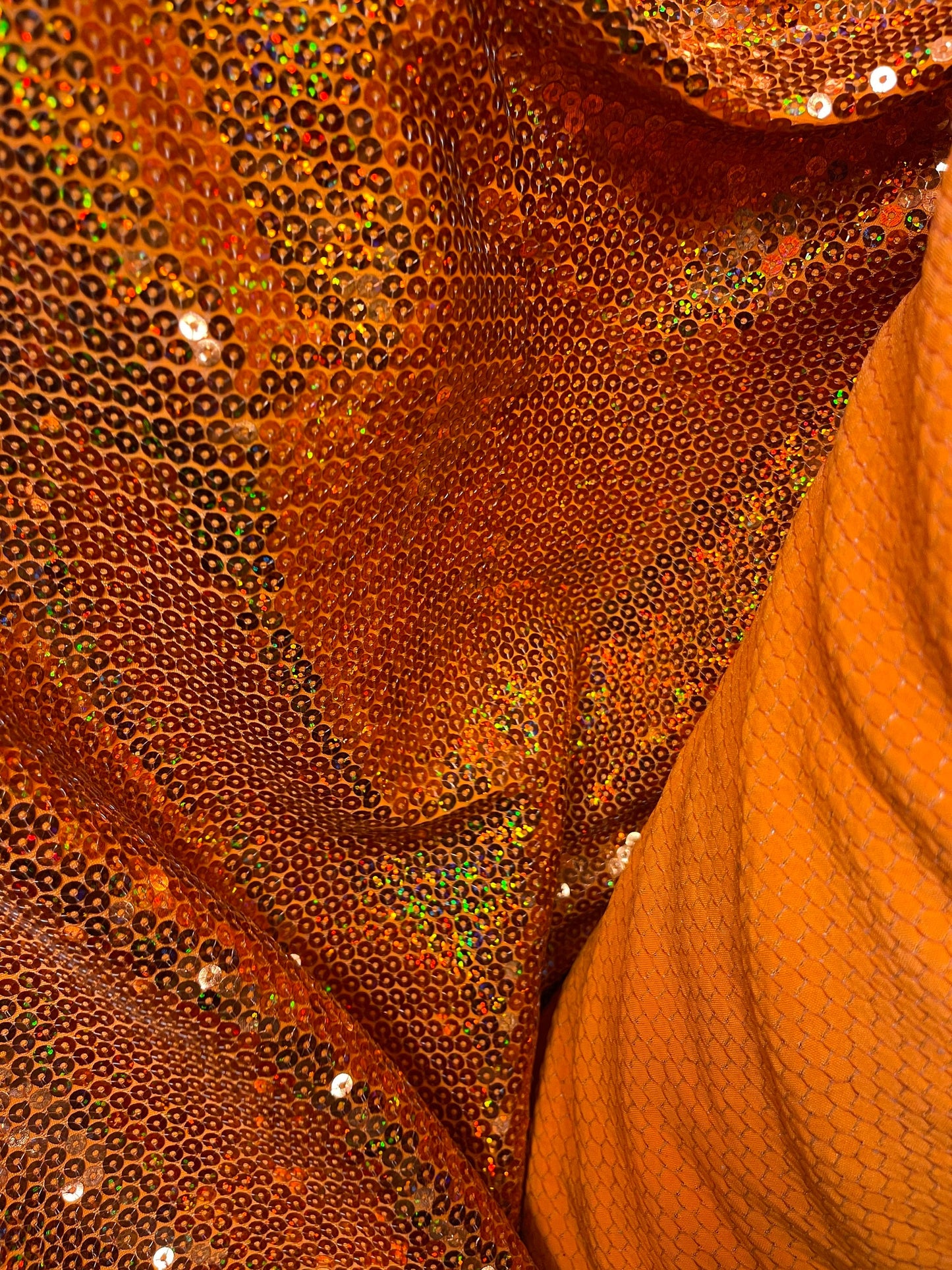 Hologram neon orange sequins embroidered on stretch spandex base 2-way 58/60” Sold by the YD. Ships Worldwide from Los Angeles California US