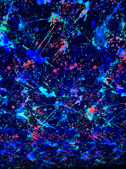 New splatter paint design Black/Multicolor print on nylon spandex 4-way stretch 58/60” Sold by the YD. It glow in the dark with Black Light