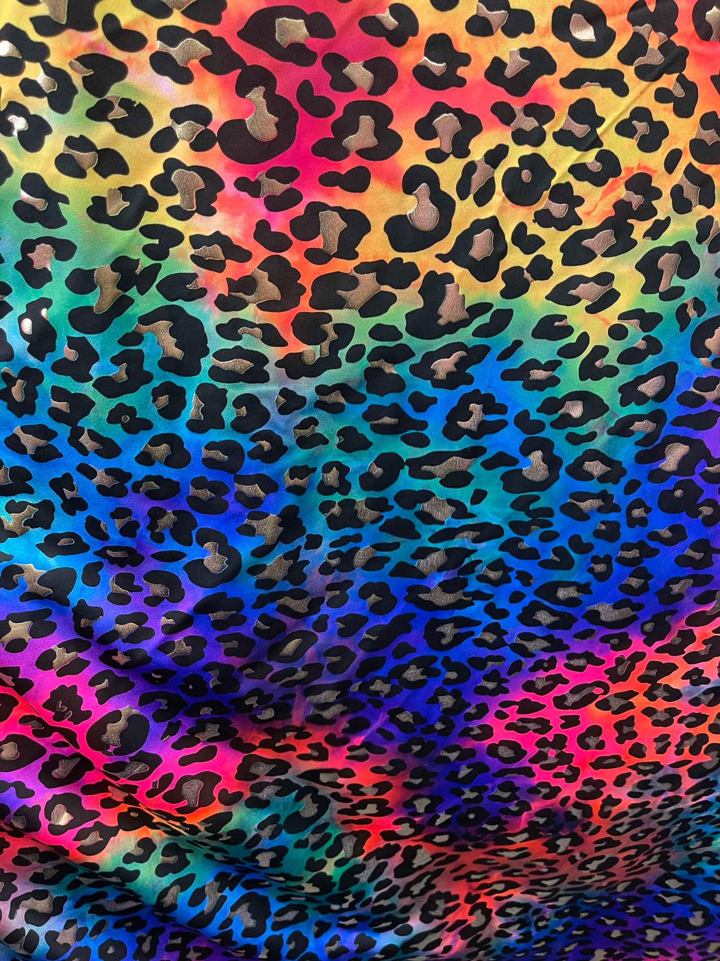 Metallic Leopard design print on Tie Dye spandex 4-way stretch 58/60” Sold by the YD. Ships Worldwide from Los Angeles California USA.