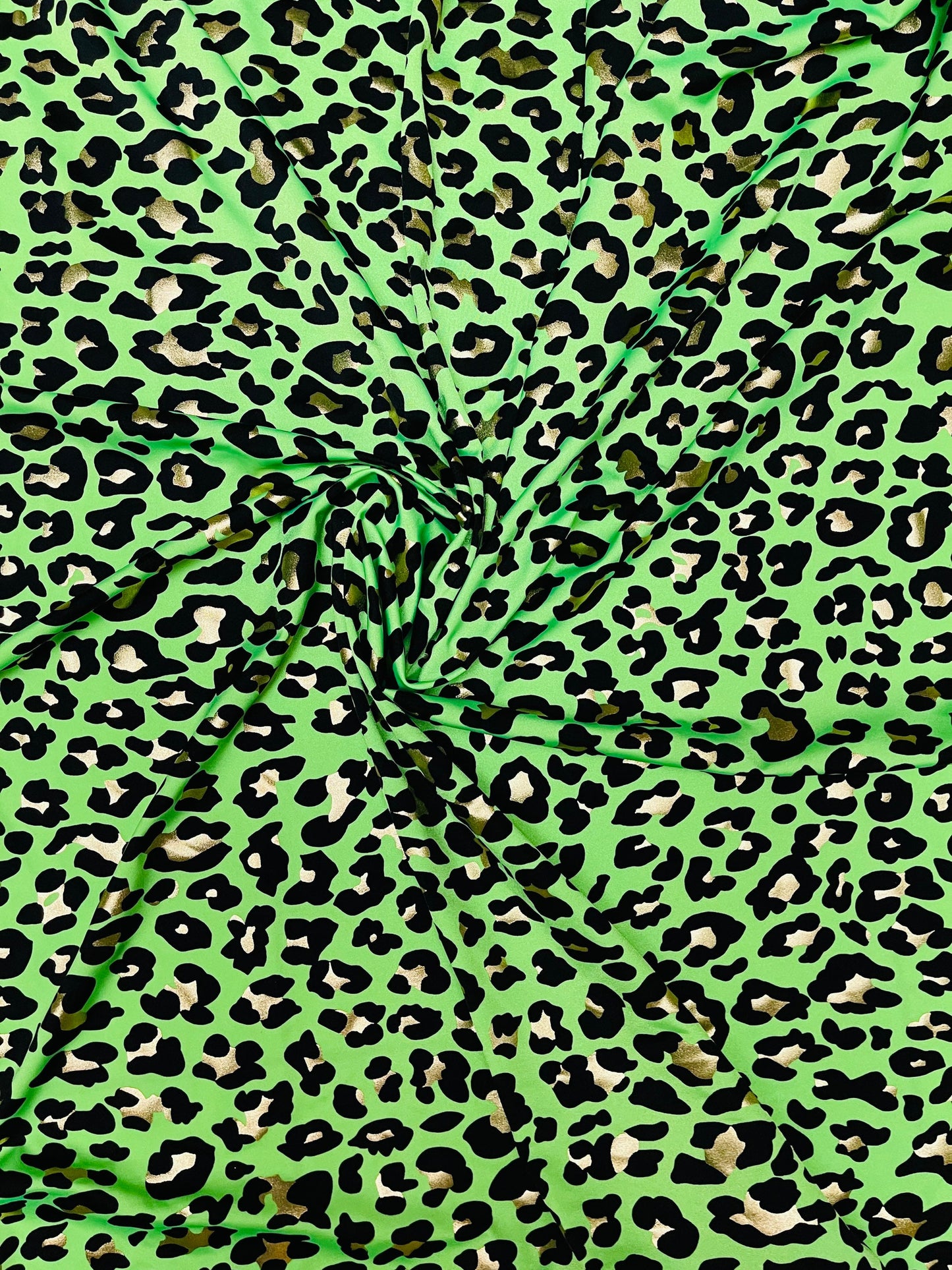 New Exotic Leopard design metallic nylon spandex 4-way stretch 58/60” Sold by the yd. Ships Worldwide from Los Angeles California USA.