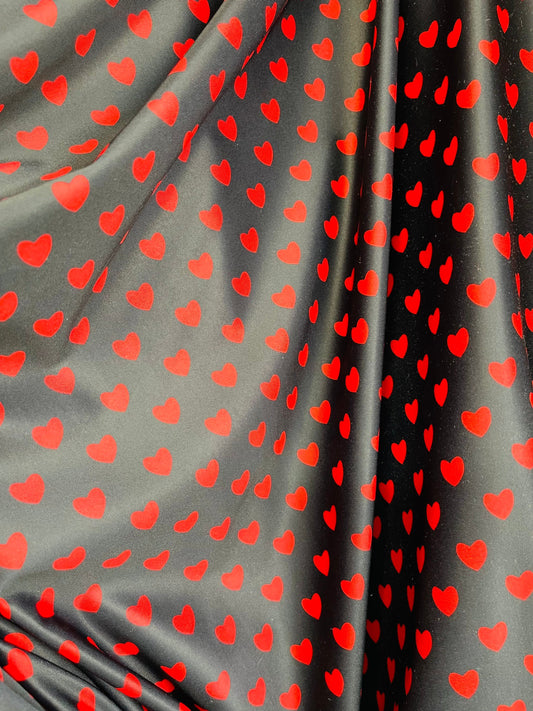 Hearts design black/red print on best quality of nylon spandex 4-way stretch 58/60” Sold by the YD. Ships Worldwide from Los Angeles cali.