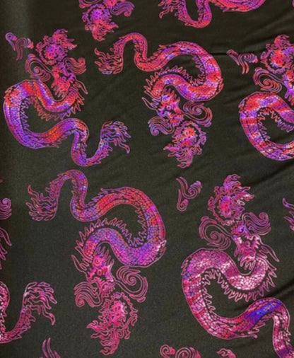 New Dragon design print on metallic nylon spandex Black Iridescent fuchsia 4-way stretch spandex 58/60” Sold by the YD. Ships worldwide