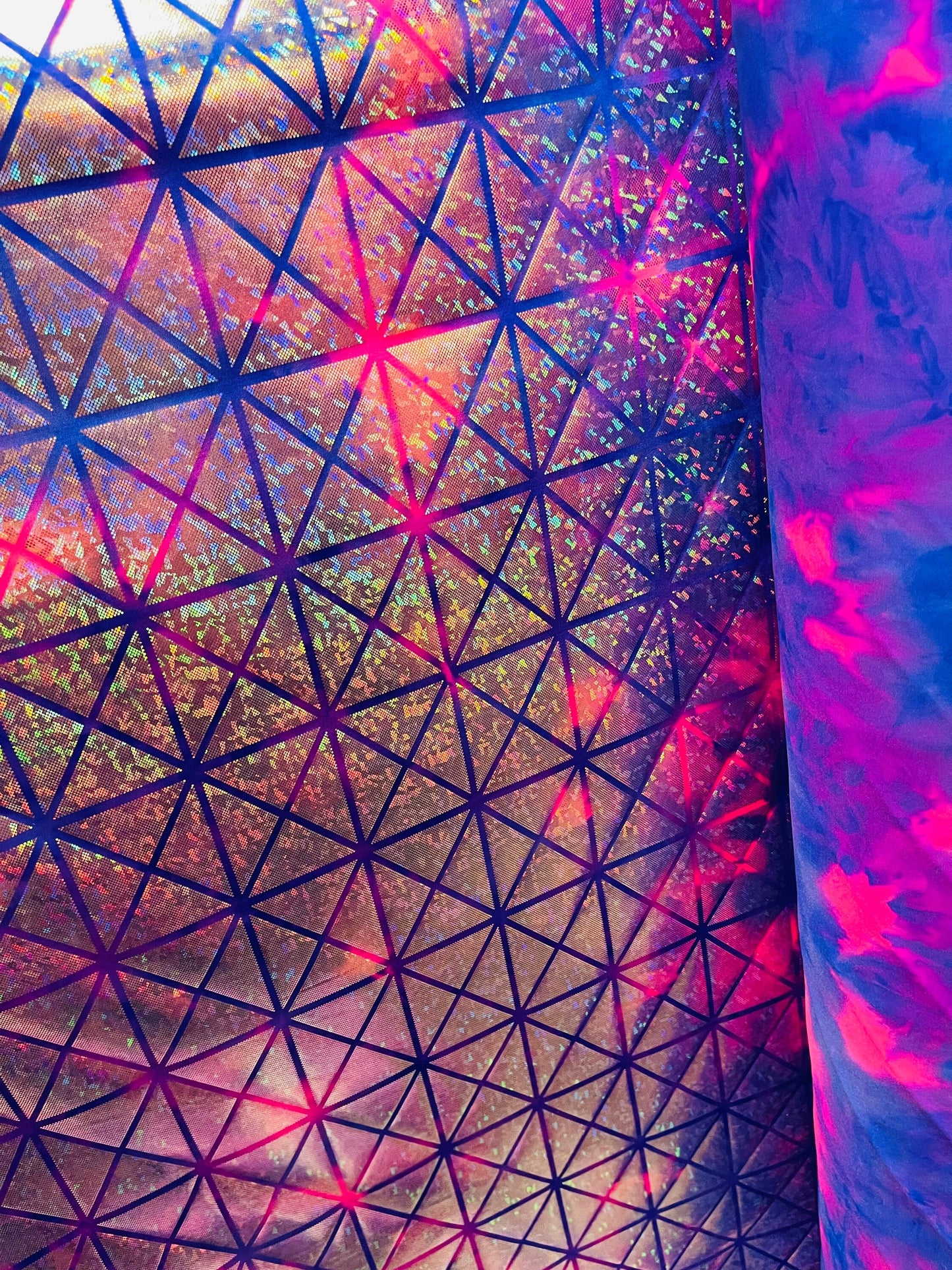 Triangles design purple/pink hologram shatter glass metallic tie dye nylon spandex 4-way stretch 58/60” Sold by the YD. Ships Worldwide