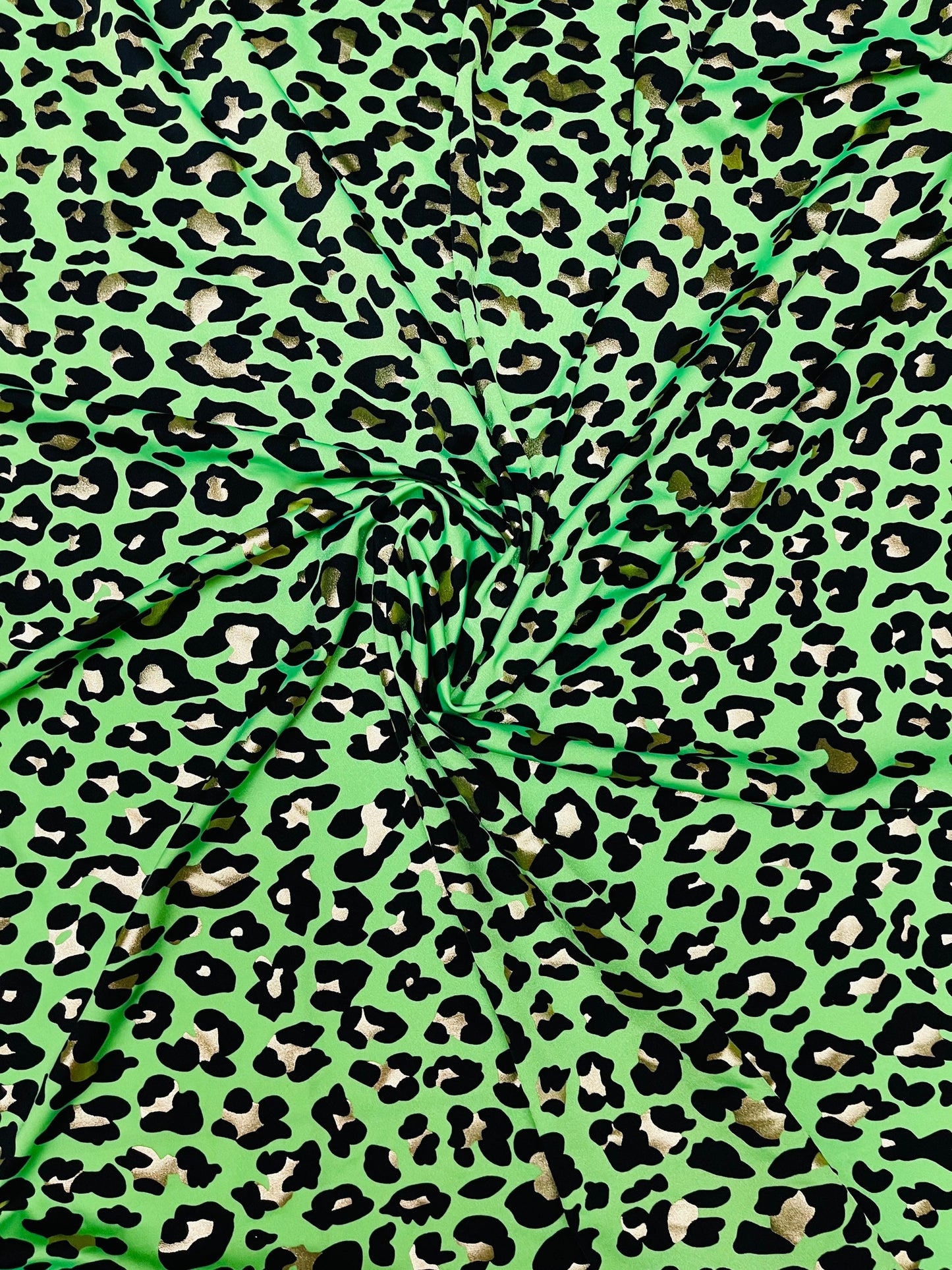 New Exotic Leopard design metallic nylon spandex 4-way stretch 58/60” Sold by the yd. Ships Worldwide from Los Angeles California USA.