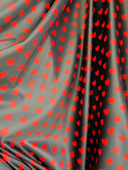 Hearts design black/red print on best quality of nylon spandex 4-way stretch 58/60” Sold by the YD. Ships Worldwide from Los Angeles cali.