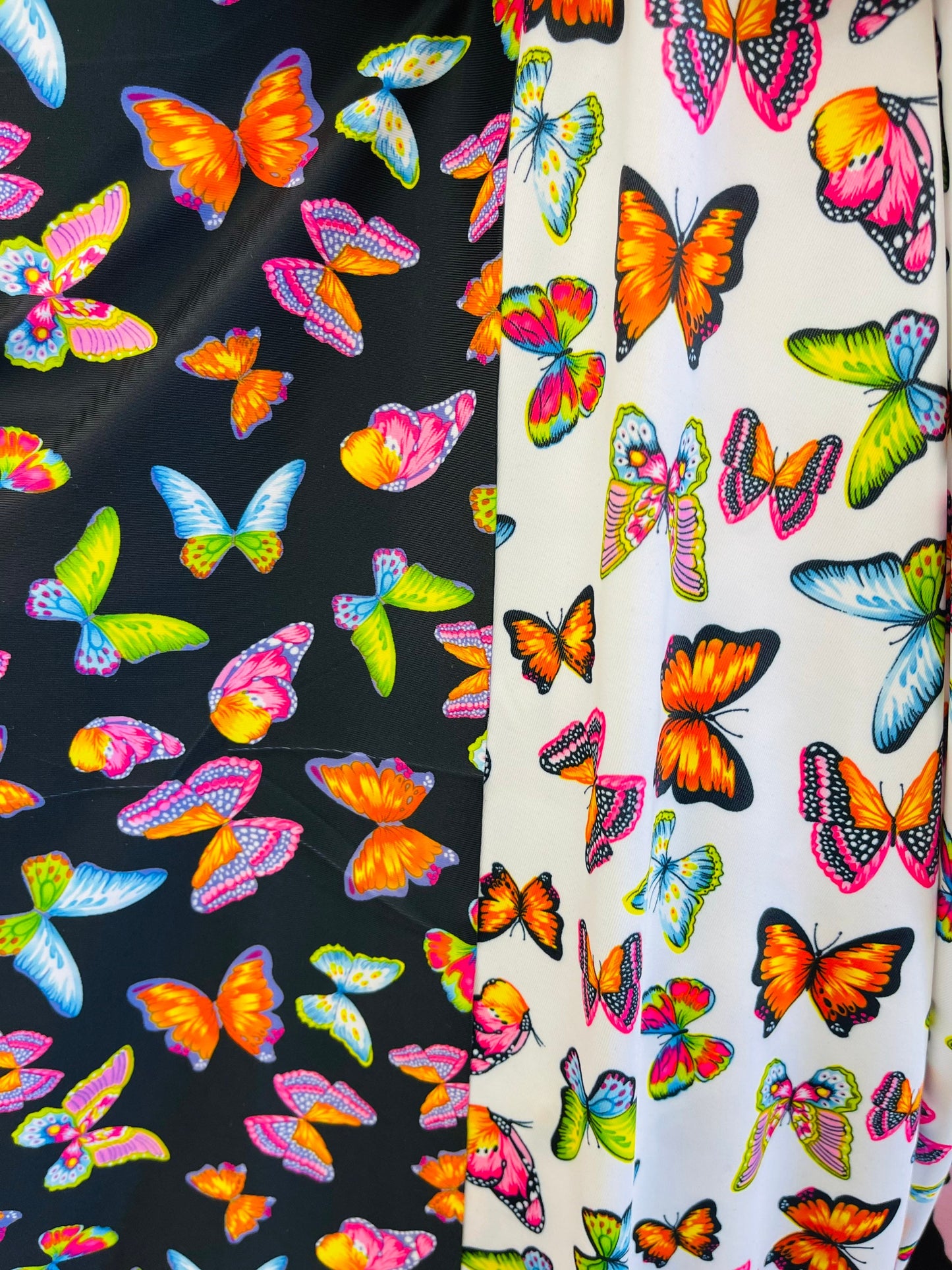 Butterfly design white/rainbow multicolor print on great quality of nylon spandex 4-way stretch 58/)0” Sold by the YD. Ships Worldwide