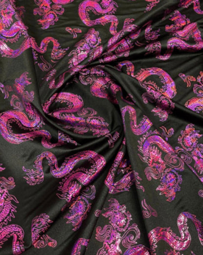 New Dragon design print on metallic nylon spandex Black Iridescent fuchsia 4-way stretch spandex 58/60” Sold by the YD. Ships worldwide