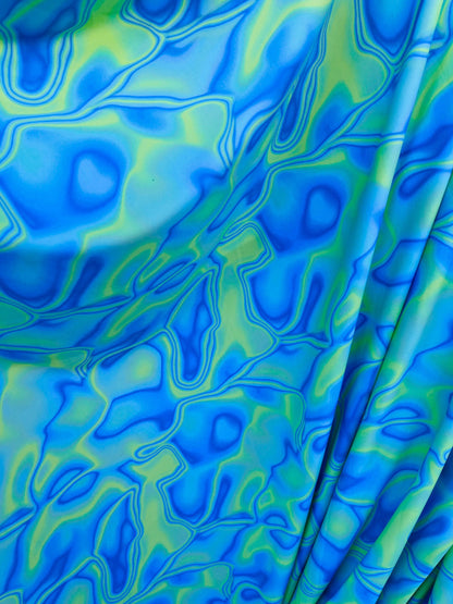 New abstract lava design Purple/blue/green print on best quality of nylon spandex 4-way stretch 58/60” Sold by the YD. Ships Worldwide