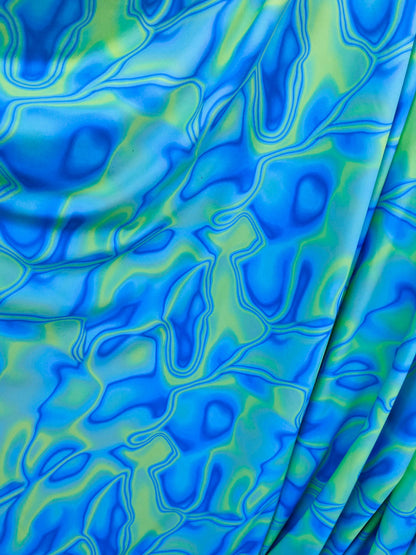 New abstract lava design Purple/blue/green print on best quality of nylon spandex 4-way stretch 58/60” Sold by the YD. Ships Worldwide