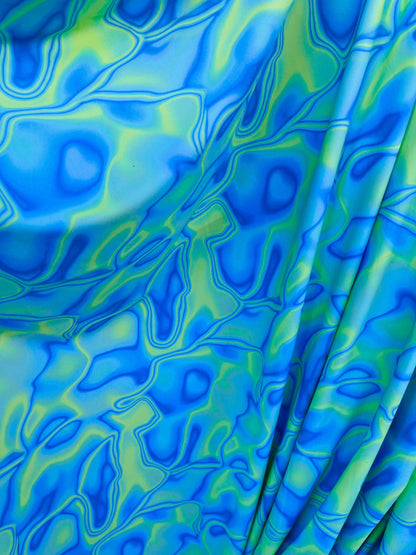 New abstract lava design Purple/blue/green print on best quality of nylon spandex 4-way stretch 58/60” Sold by the YD. Ships Worldwide