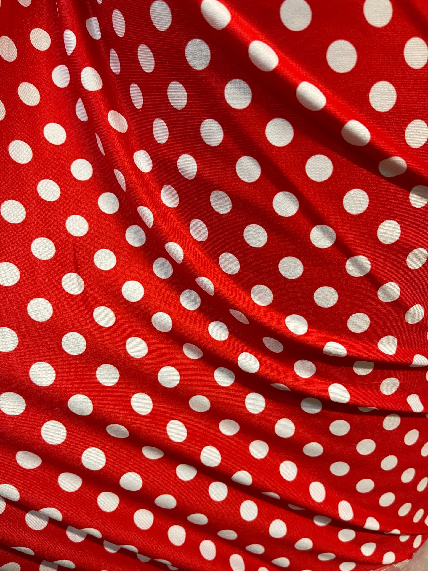 New spandex polka dots Design Red/white 4 way stretch nylon spandex 58/60” Sold by the YD. Ships worldwide from Los Angeles California USA.