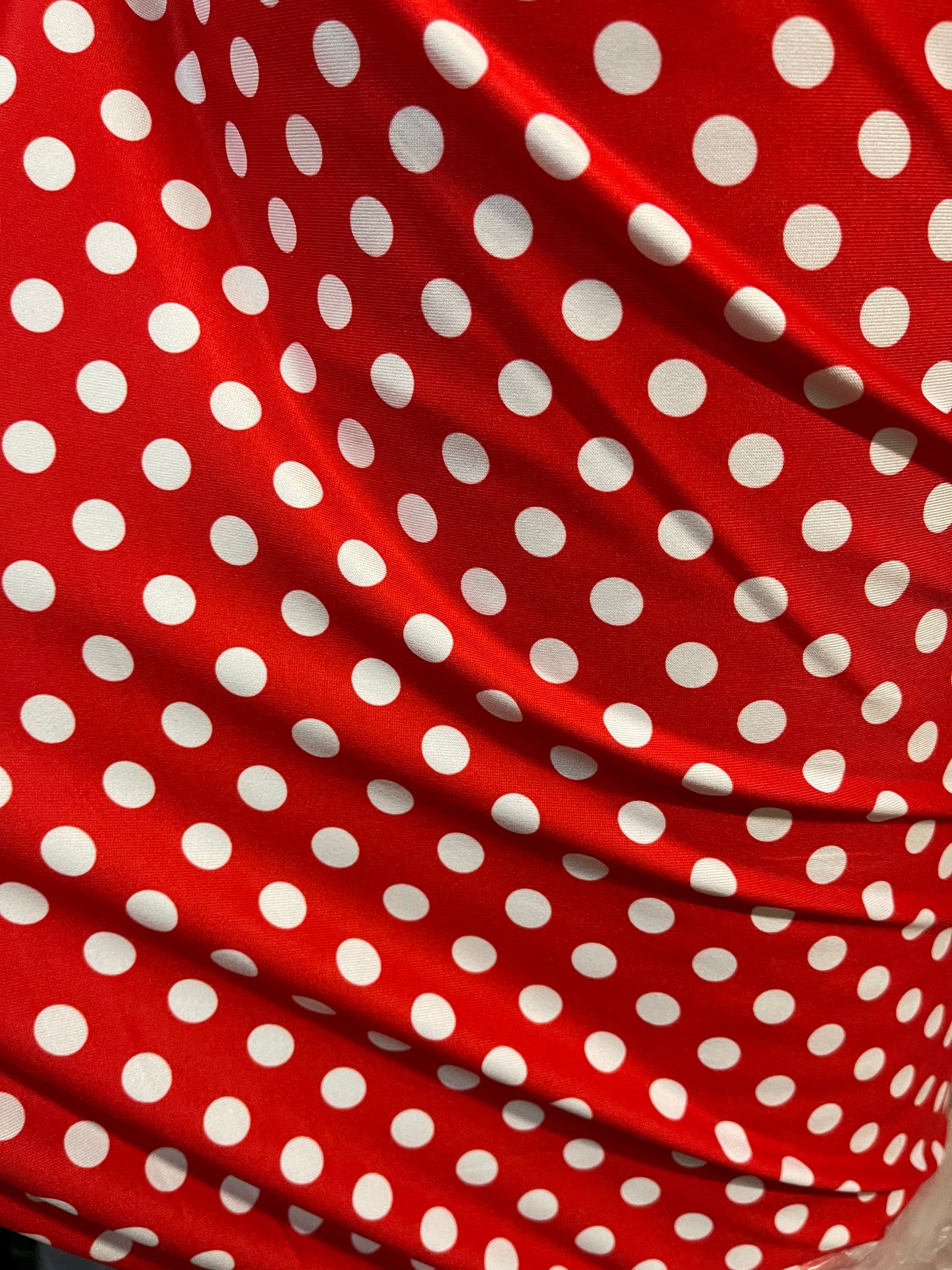 New spandex polka dots Design Red/white 4 way stretch nylon spandex 58/60” Sold by the YD. Ships worldwide from Los Angeles California USA.