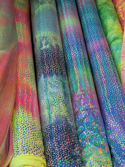 Dragon scales design Iridescent sequins on Tie Dye nylon spandex 4-way stretch 58/60” Sold by the YD. Ships Worldwide from Los Ángeles CA US