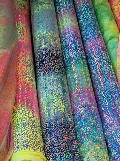 Dragon scales design Iridescent sequins on Tie Dye nylon spandex 4-way stretch 58/60” Sold by the YD. Ships Worldwide from Los Ángeles CA US