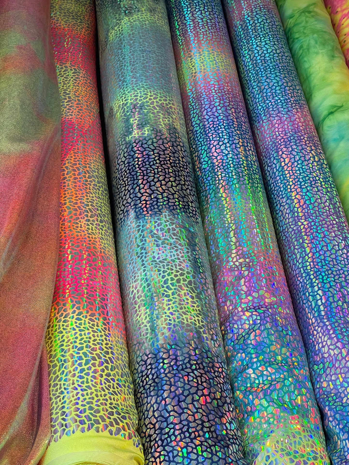 Dragon scales design Iridescent sequins on Tie Dye nylon spandex 4-way stretch 58/60” Sold by the YD. Ships Worldwide from Los Ángeles CA US