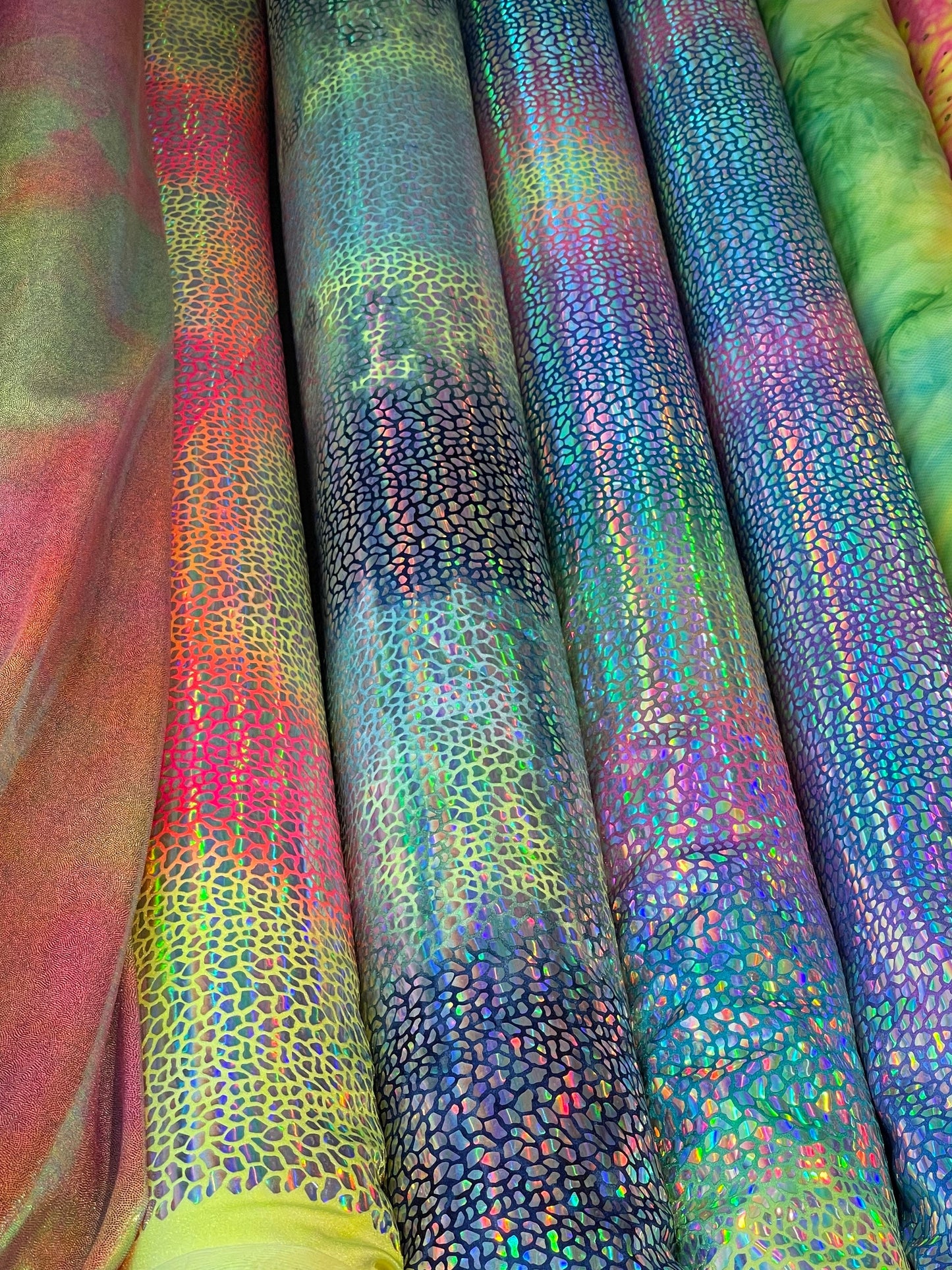 Dragon scales design Iridescent sequins on Tie Dye nylon spandex 4-way stretch 58/60” Sold by the YD. Ships Worldwide from Los Ángeles CA US