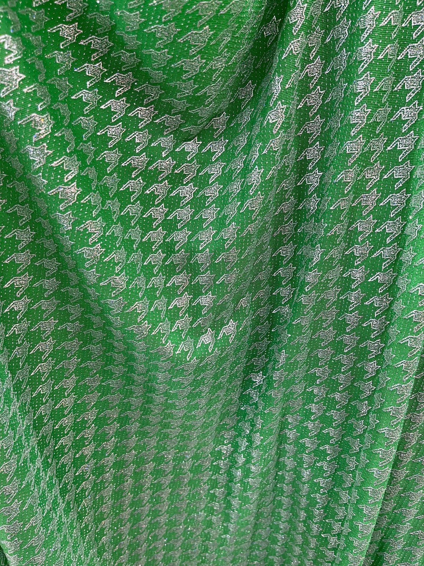 New metallic houndstooth design print on poly spandex 2-way stretch 58/60” Sold by the YD. Ships Worldwide from Los Angeles California USA.