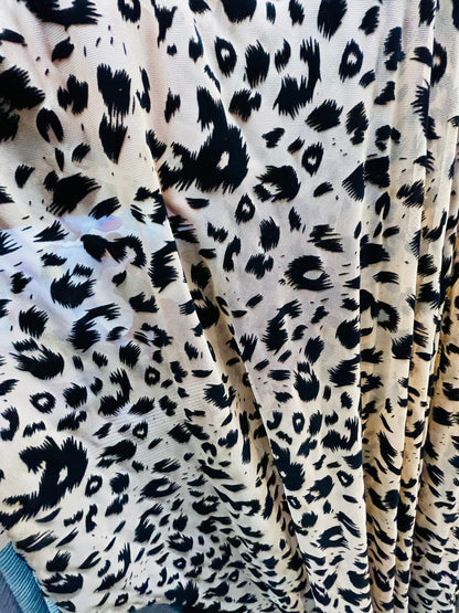 New Exotic leopard design flocking power mesh 4-way stretch 58/60” Sold by the YD. Ships Worldwide from Los Angeles California USA.