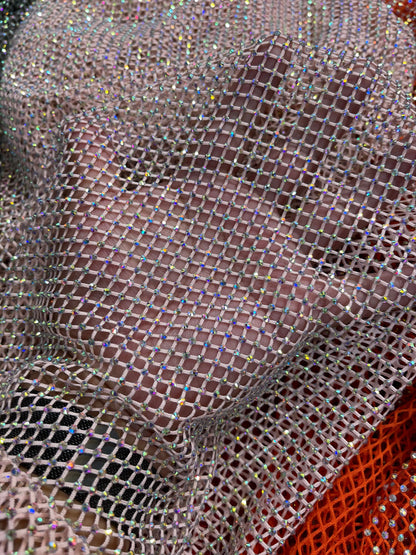 New Luxury Rhinestone stretch mesh fabric 4-way stretch 58/60” Sold by the YD. Ships Worldwide from Los Angeles California USA.