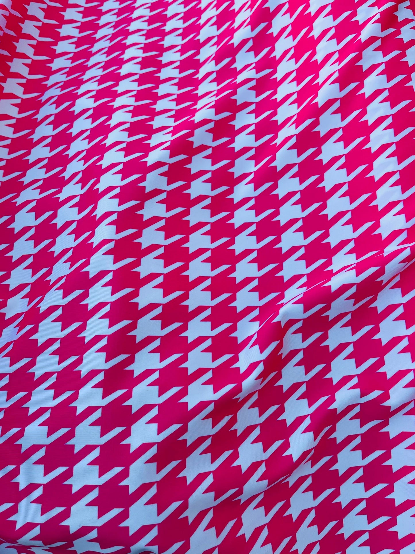 Houndstooth design Hot pink/White print on great quality of nylon spandex  4-way stretch 58/60” Sold by the YD. Ships worldwide from L.A CA