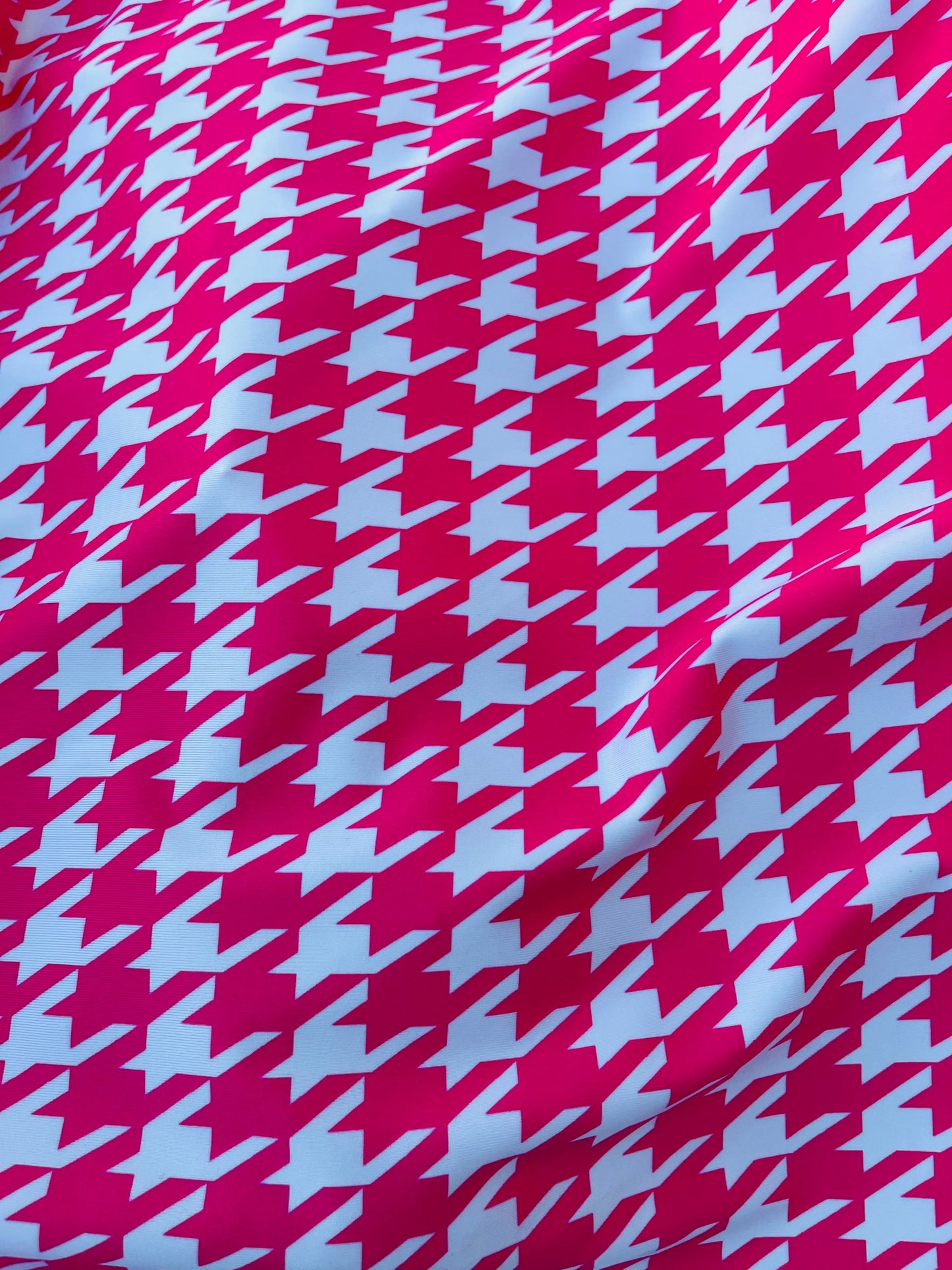 Houndstooth design Hot pink/White print on great quality of nylon spandex  4-way stretch 58/60” Sold by the YD. Ships worldwide from L.A CA