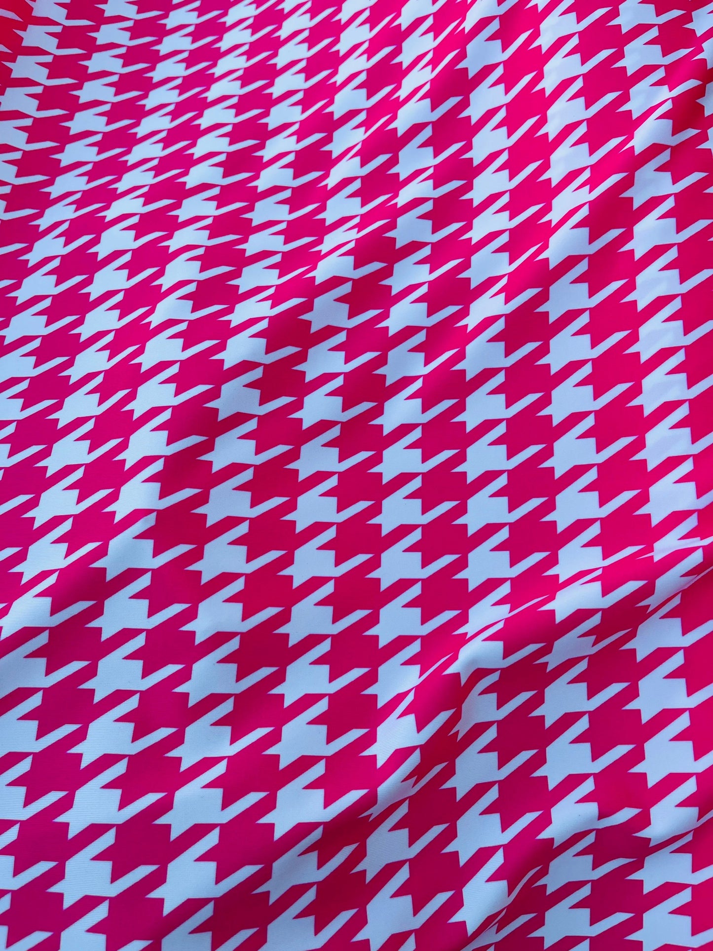 Houndstooth design Hot pink/White print on great quality of nylon spandex  4-way stretch 58/60” Sold by the YD. Ships worldwide from L.A CA