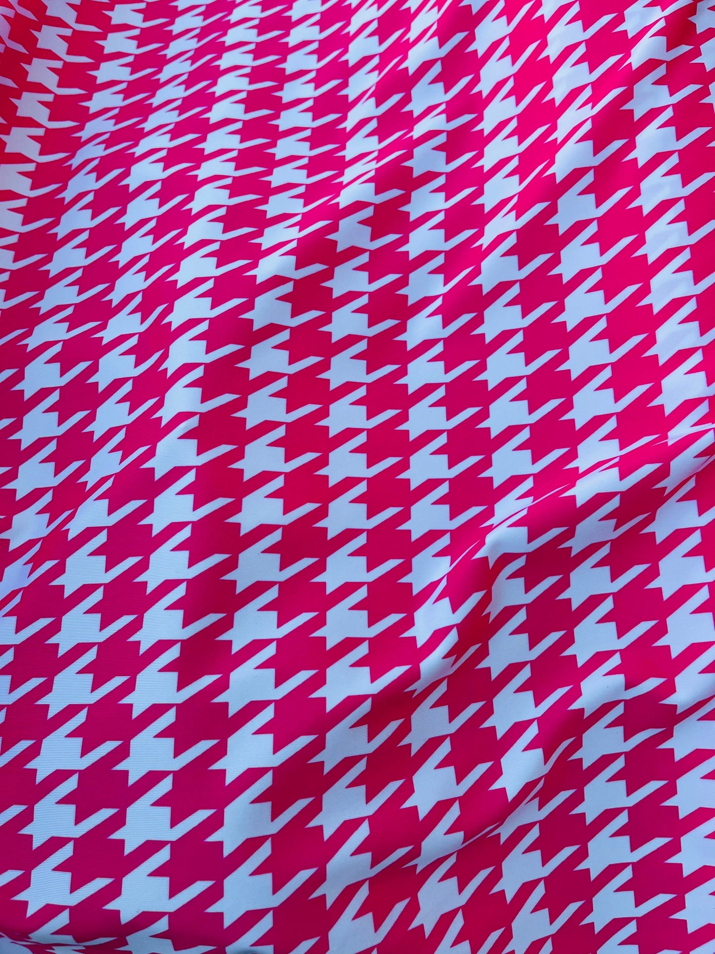 Houndstooth design Hot pink/White print on great quality of nylon spandex  4-way stretch 58/60” Sold by the YD. Ships worldwide from L.A CA