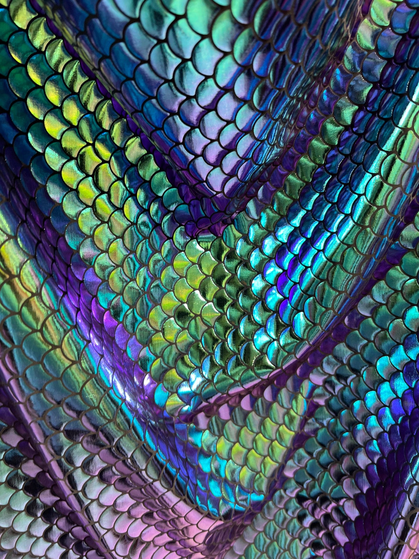 Mermaid design Iridescent green/blue/purple 4-way stretch 58/60” Sold by the YD. Ships worldwide from Los Angeles California USA