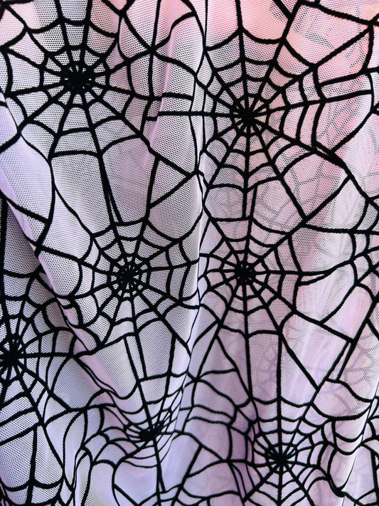 Spiderweb design pink/black flocking stretch power mesh 4-way 58/60” Sold by the YD. Ships worldwide from Los Angeles California USA.