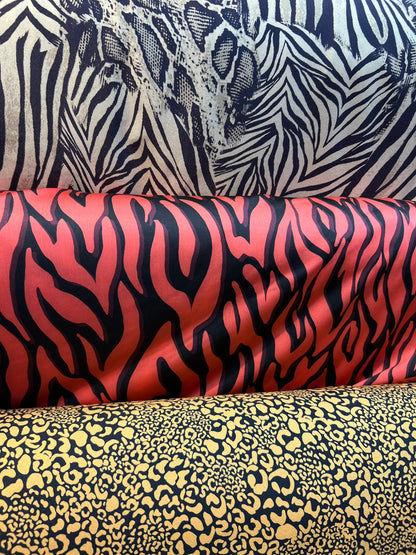 Exotics  Multi animal print spandex 4-way stretch 58/60” Sold by the YD. Ships worldwide from Los Angeles California USA.