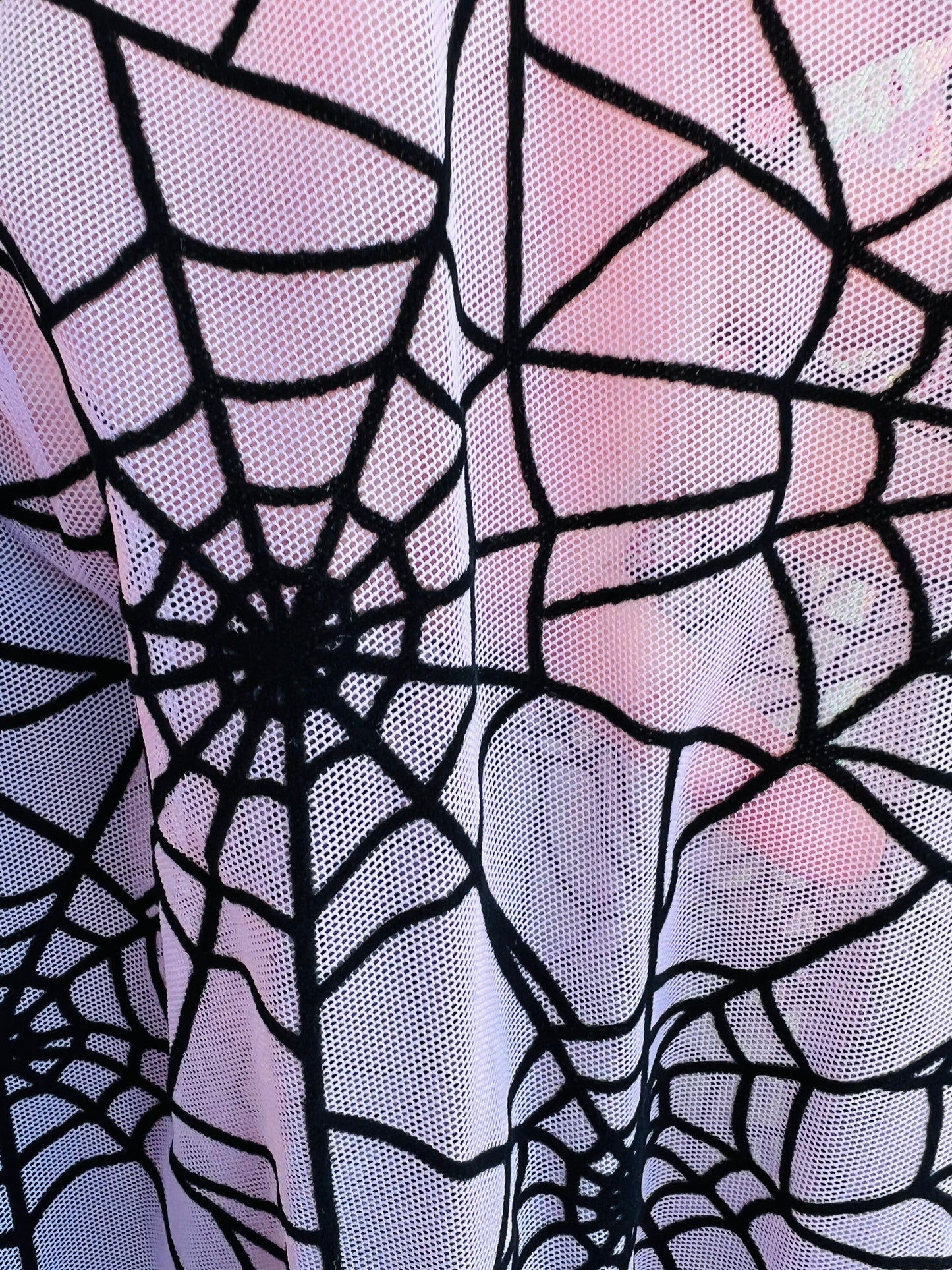 Spiderweb design pink/black flocking stretch power mesh 4-way 58/60” Sold by the YD. Ships worldwide from Los Angeles California USA.