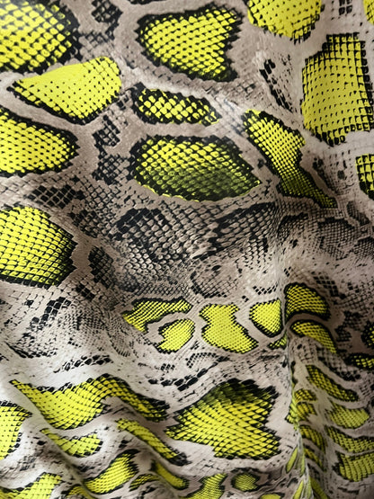 Exotic snake design Taupe/Green print on poly spandex 4-way stretch 58/60” Sold by the YD. Ships worldwide from Los Angeles California USA.