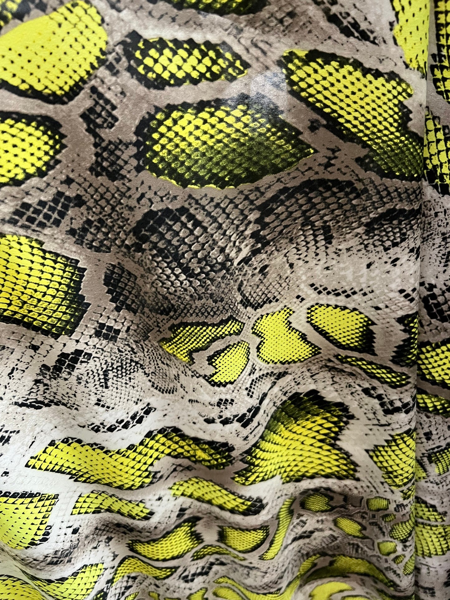 Exotic snake design Taupe/Green print on poly spandex 4-way stretch 58/60” Sold by the YD. Ships worldwide from Los Angeles California USA.