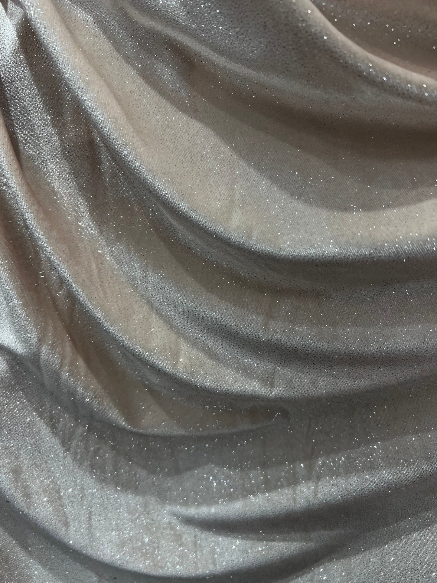 Silver Glitter on stretch velvet 420 GSM  4-way stretch 58/60” Sold by the YD. Ships Worldwide from Los Angeles California USA.