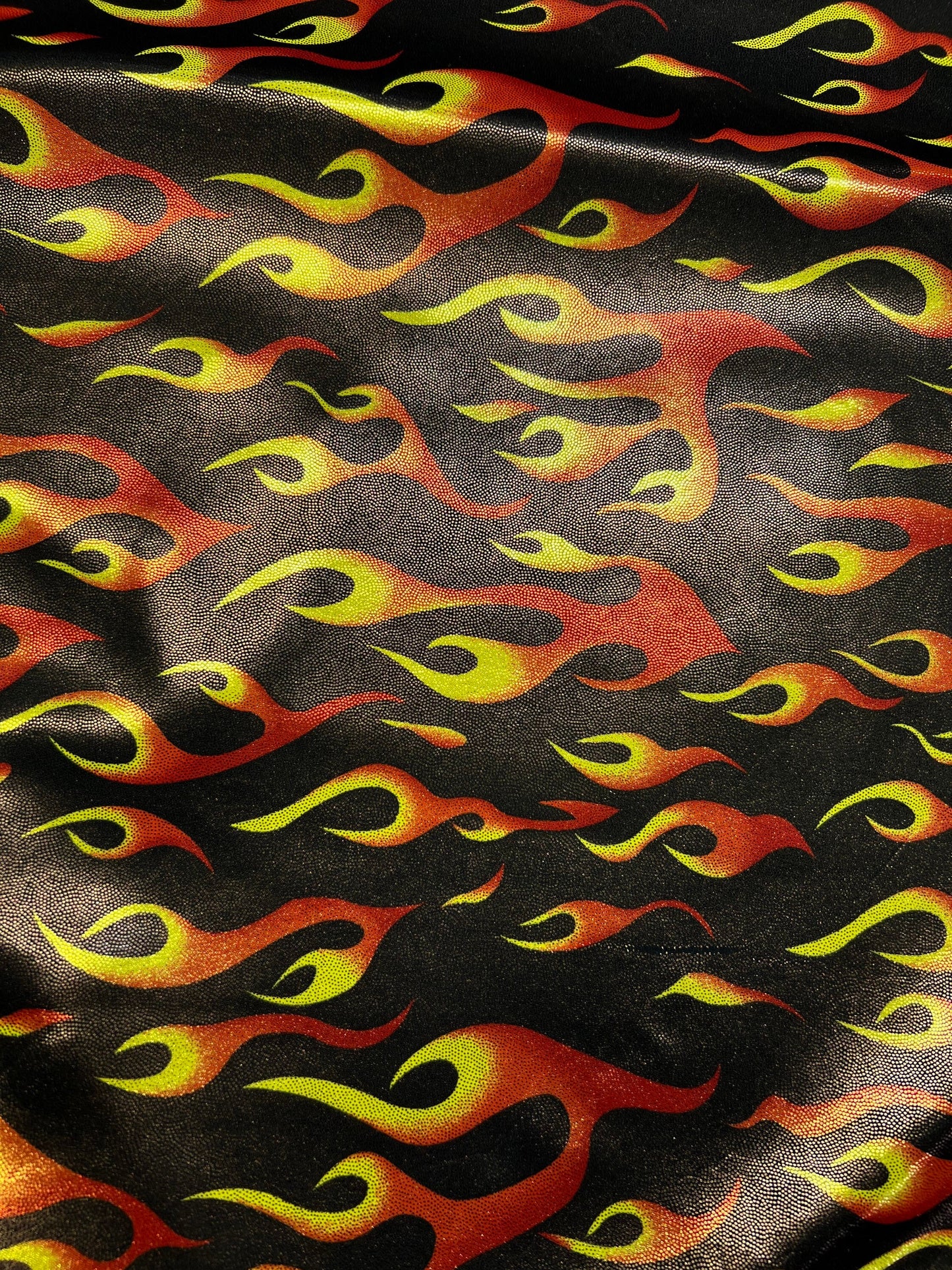 Hot flames design metallic nylon spandex 4-way stretch 58/60” Sold by the YD. Ships Worldwide from Los Angeles California USA.