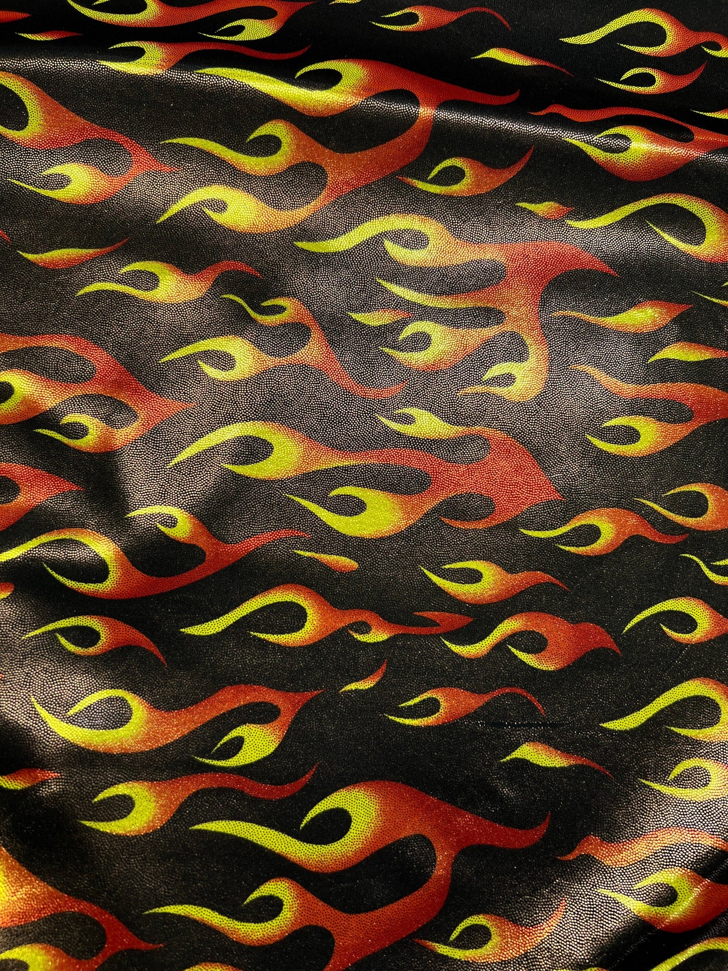 Hot flames design metallic nylon spandex 4-way stretch 58/60” Sold by the YD. Ships Worldwide from Los Angeles California USA.