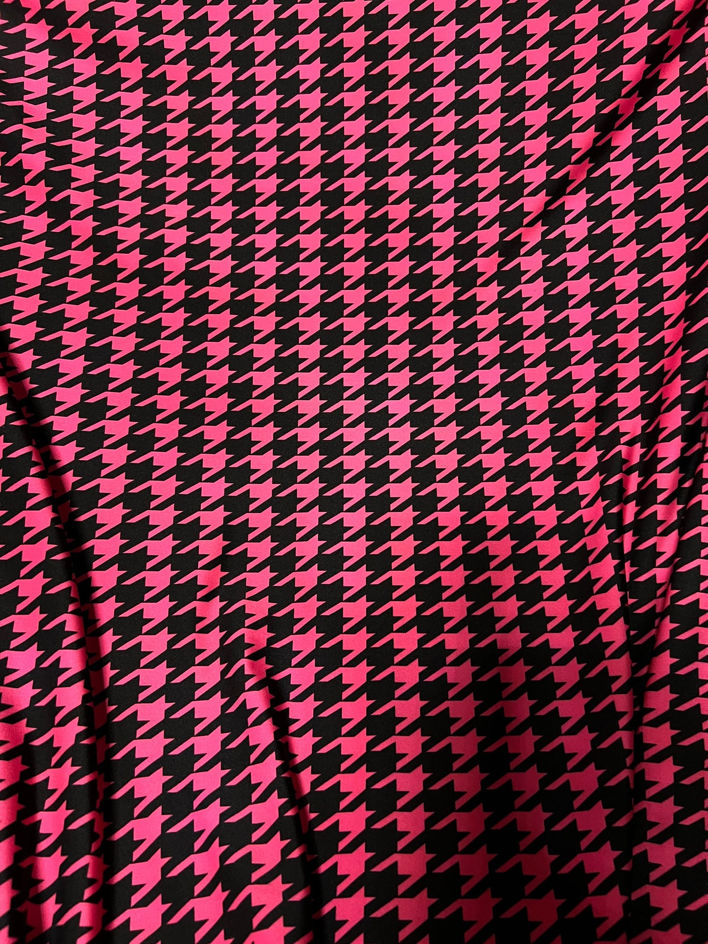 New houndstooth design hot pink/black print on poly spandex 4way stretch 58/60" Sold by the YD. Ships worldwide from Los Angeles California.