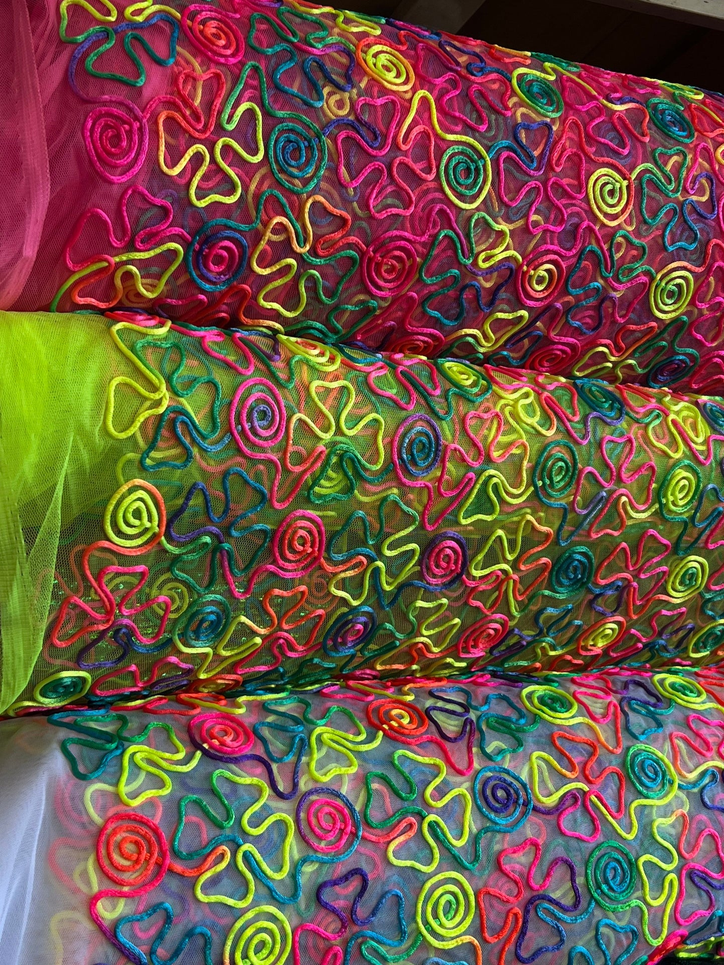 Embroidery rainbow lace swirl design 2-way stretch 55/57” Sold by the YD. Ships Worldwide from Los Angeles California USA.