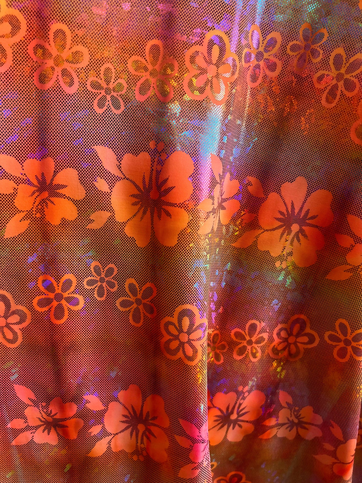 Hawaiian design hologram metallic nylon spandex 4-way stretch 58/60” Sold by the YD. Ships Worldwide from Los Angeles California USA.