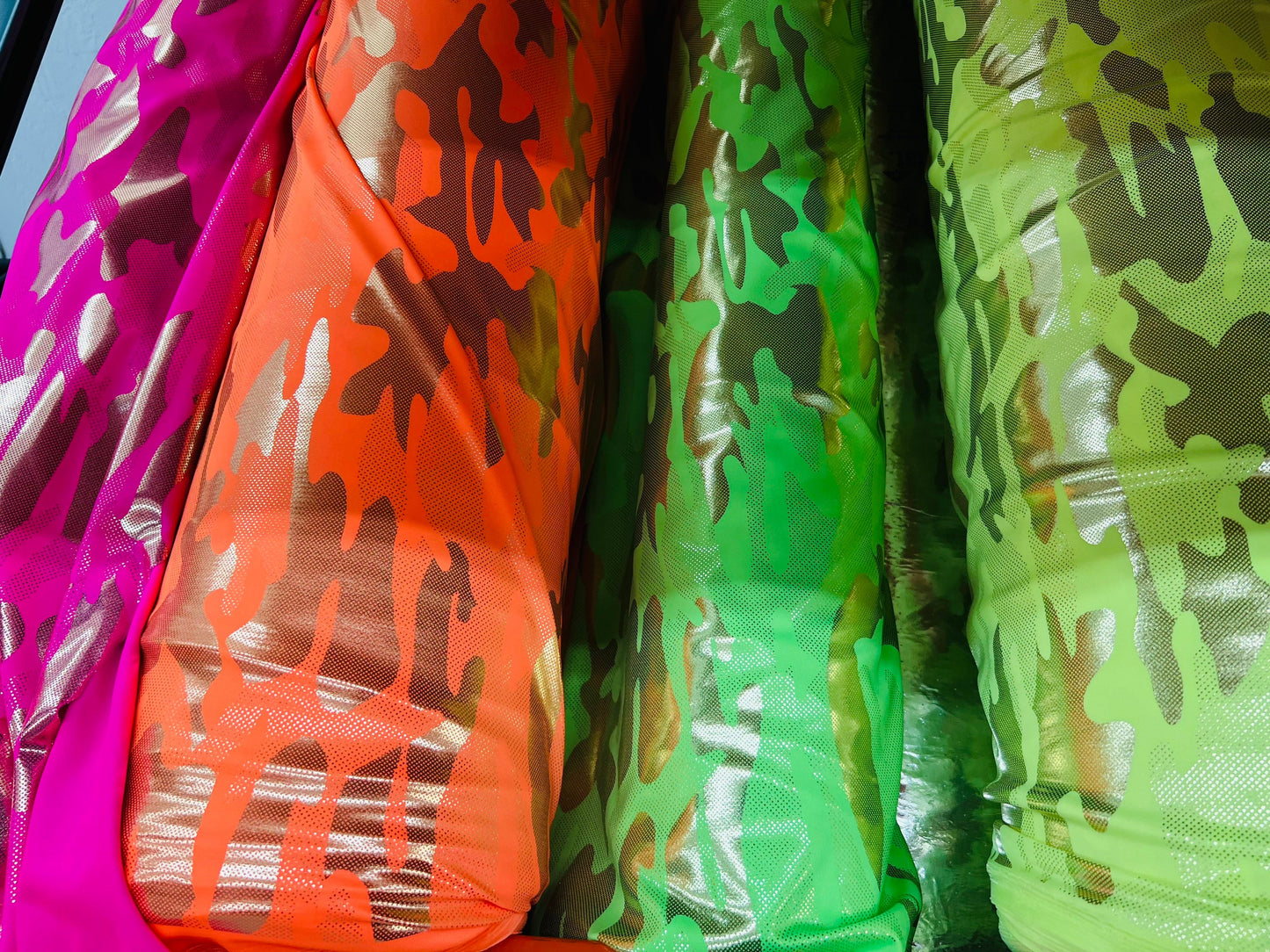 Camouflage design neon colors metallic nylon spandex 4-way stretch 58/60” Sold by the YD. Ships Worldwide from Los Angeles California USA