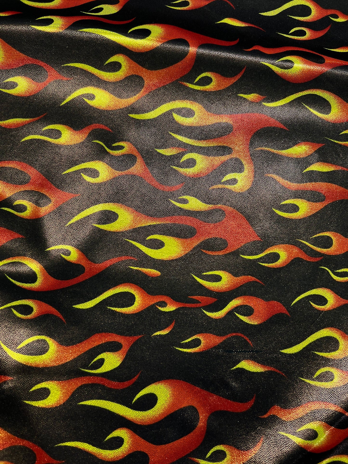 Hot flames design metallic nylon spandex 4-way stretch 58/60” Sold by the YD. Ships Worldwide from Los Angeles California USA.