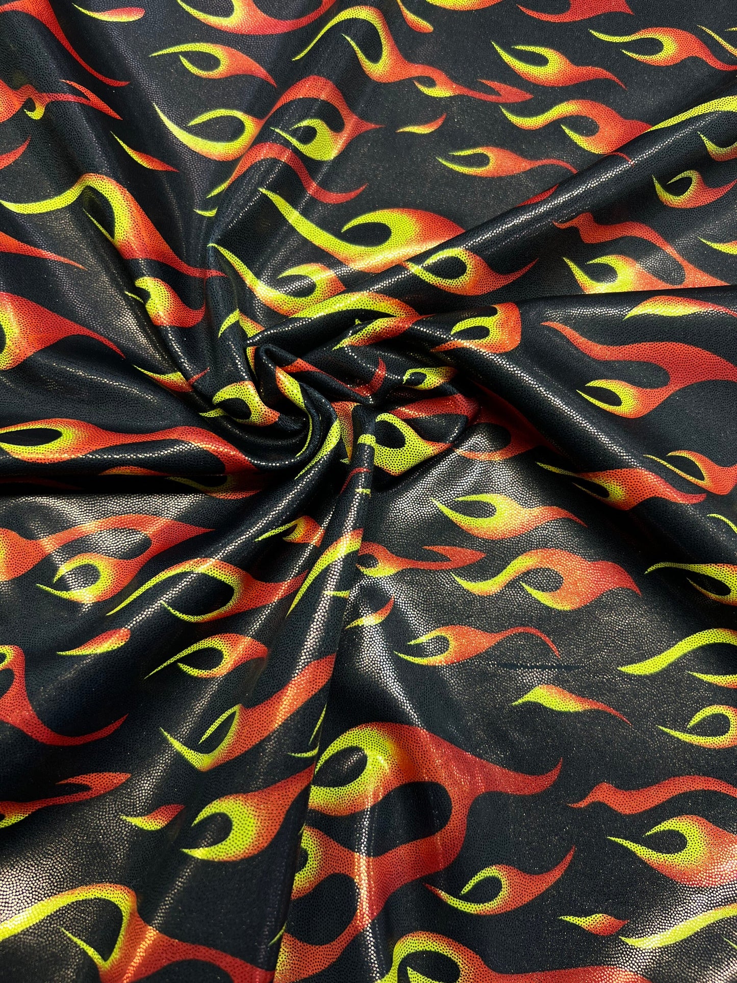 Hot flames design metallic nylon spandex 4-way stretch 58/60” Sold by the YD. Ships Worldwide from Los Angeles California USA.