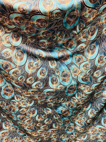 Peacock design New print in stock  Teal blue/Gold print on great quality of nylon spandex 4-way stretch 58/60”