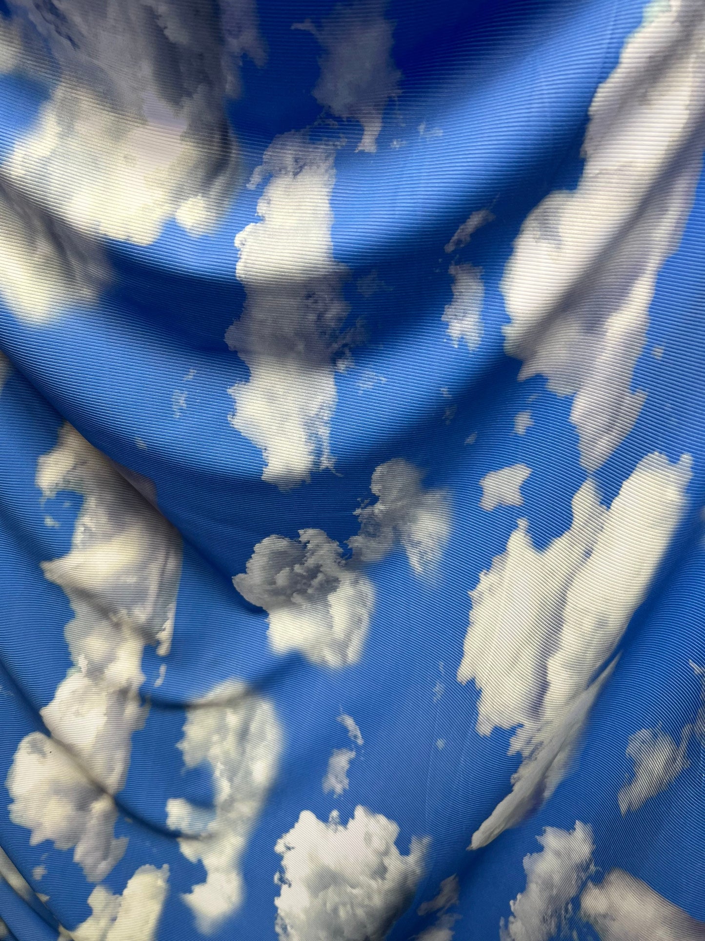 Clouds design print on great quality of ribbed nylon spandex 4-way stretch 58/60” Sold by the YD. Ships Worldwide from Los Angeles CA