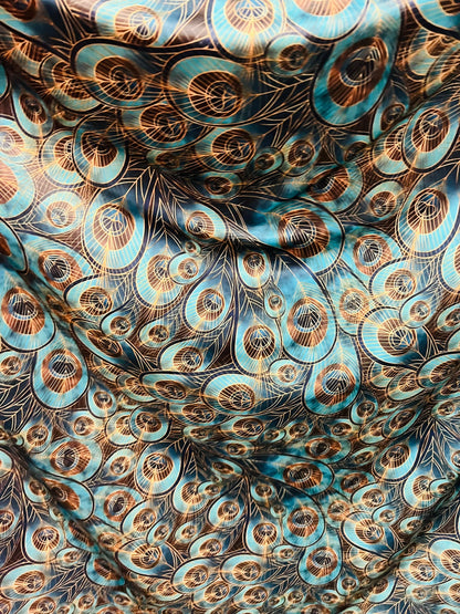 Peacock design New print in stock  Teal blue/Gold print on great quality of nylon spandex 4-way stretch 58/60”