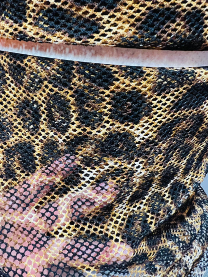 Exotic Leopard design print on poly fishnet 2-way stretch 58/60” Sold by the YD. Ships Worldwide from Los Angeles California USA