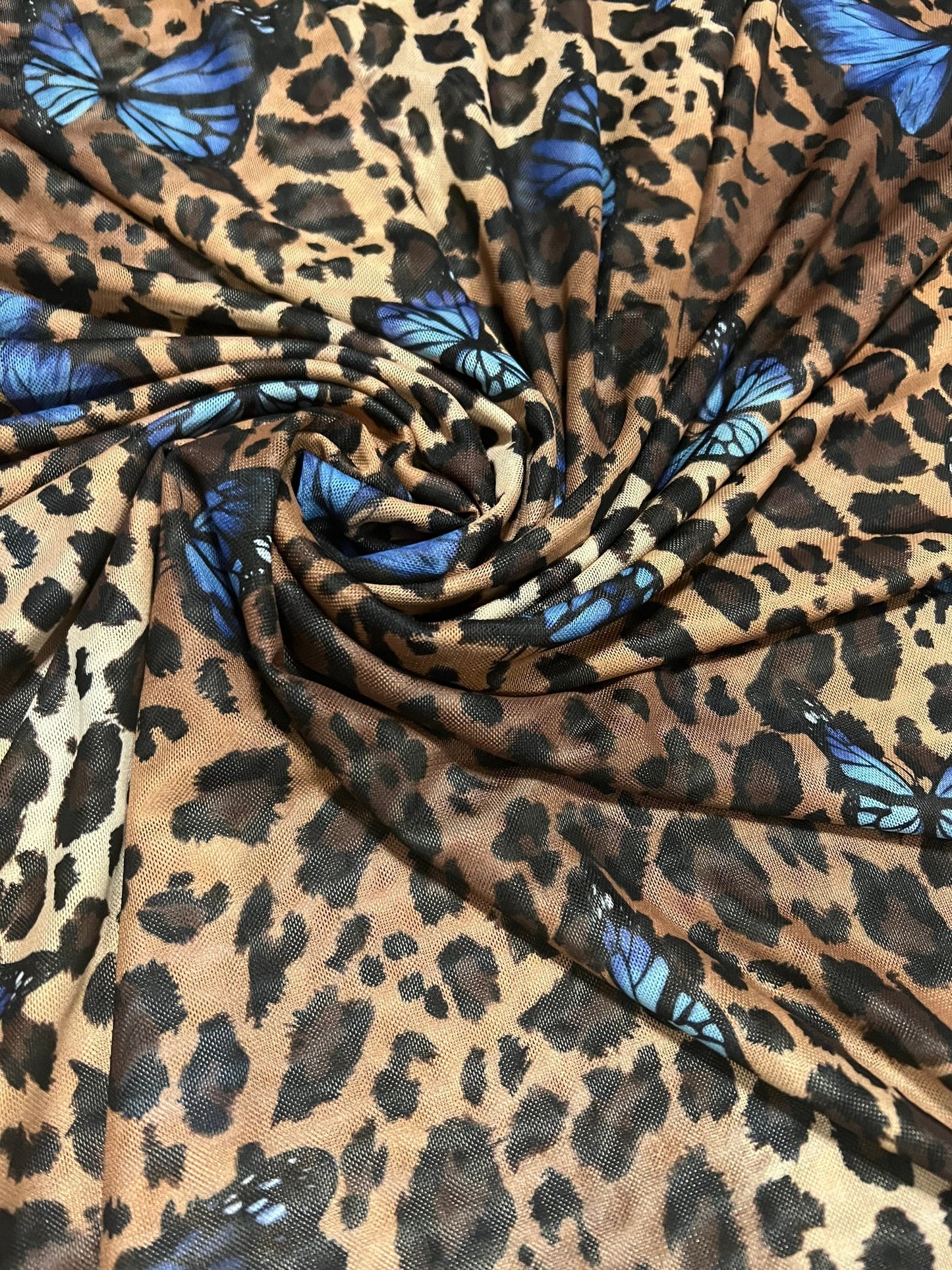 New Exotic leopard & Butterfly design print on great quality of power mesh nylon spandex 4-way stretch 58/60” Sold by the YD.