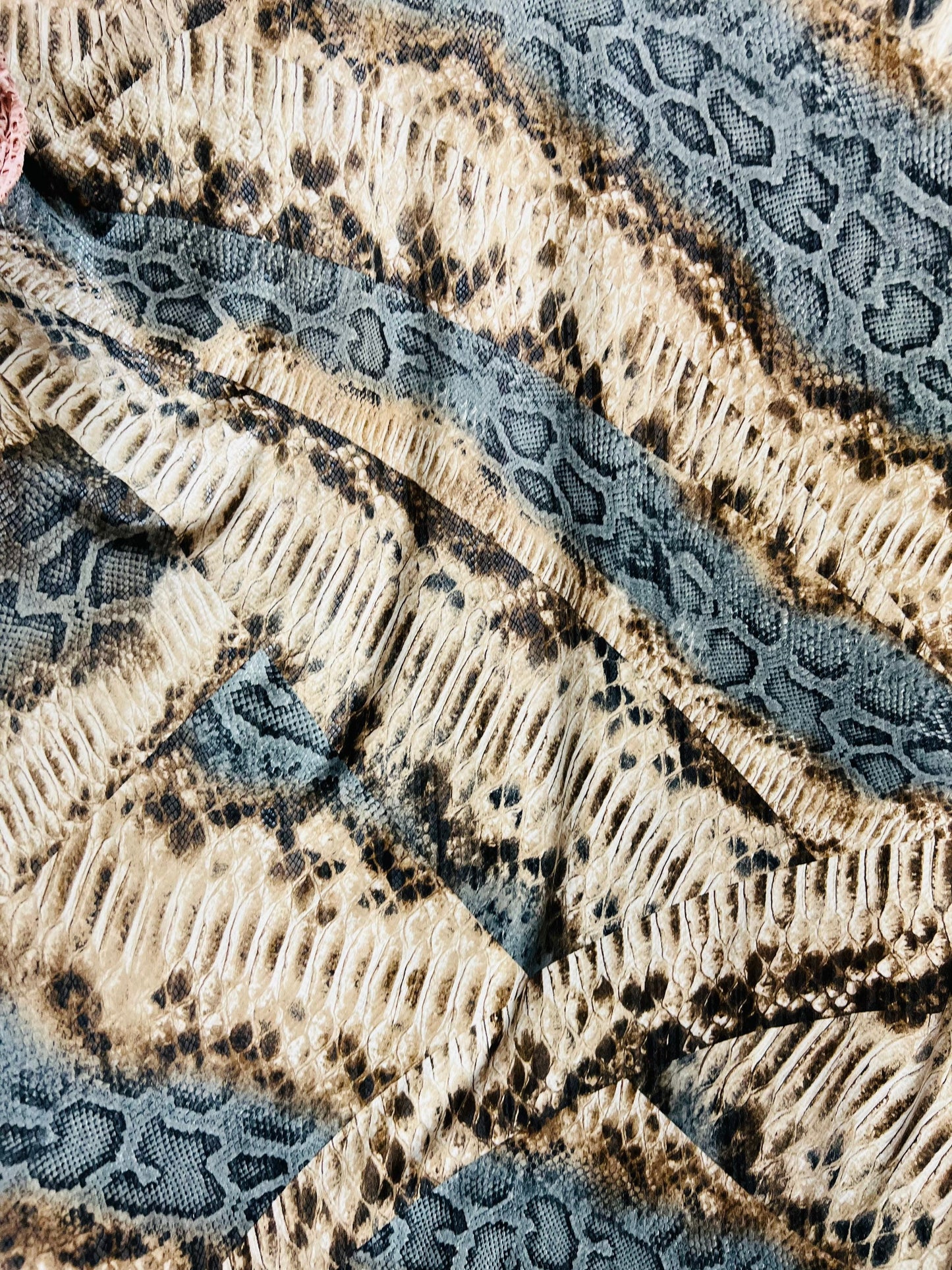 Snake design Nude/Gray/Brown print on great quality of poly spandex 2-way stretch 58/60” Sold by the YD. Ships Worldwide from Los Angeles