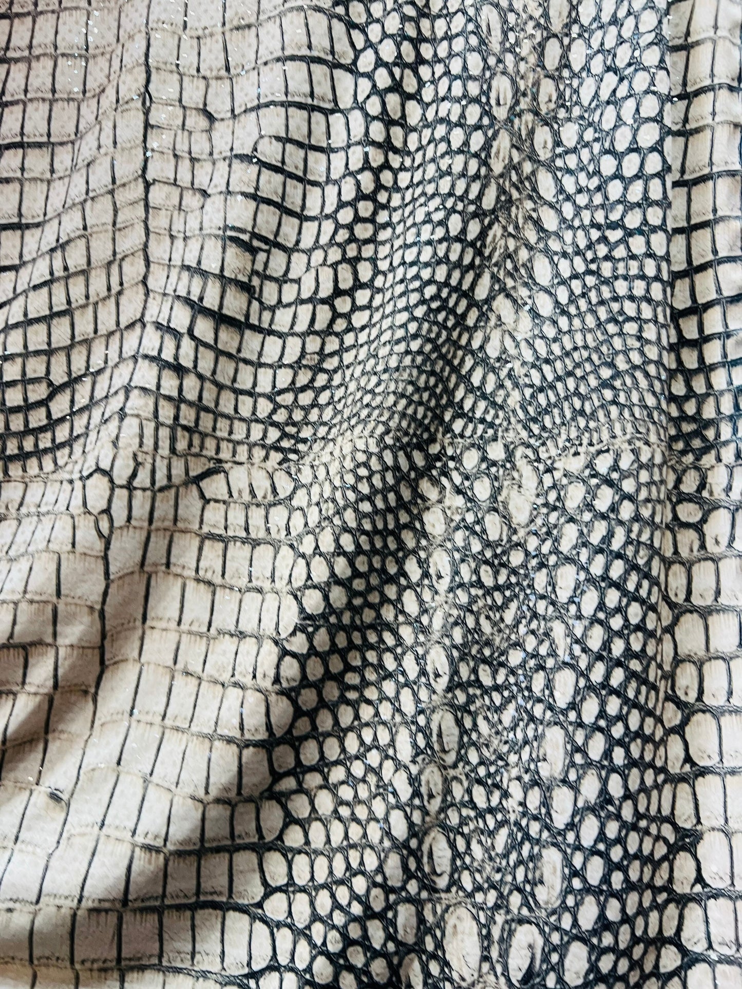 Crocodile design Nude/Gray/Brown print on great quality of poly spandex 2-way stretch 58/60” Sold by the YD. Ships Worldwide